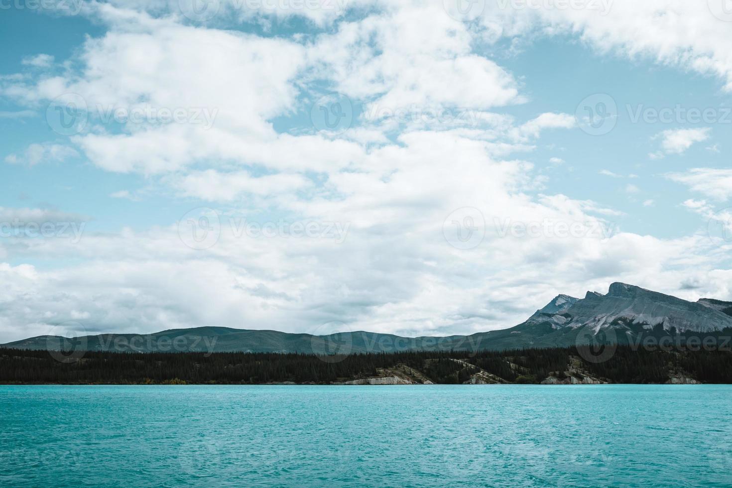 Majestic lake in West Canada with turquoise water and mountains photo