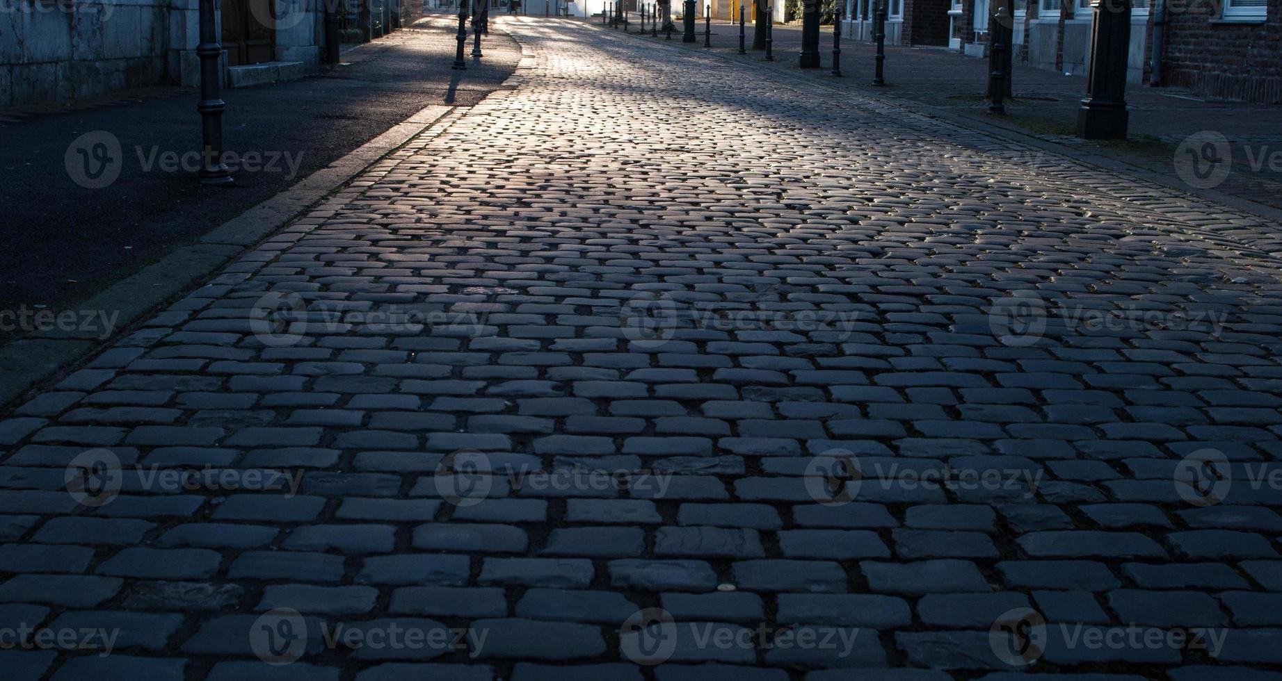 empty road cobblestones in the city photo