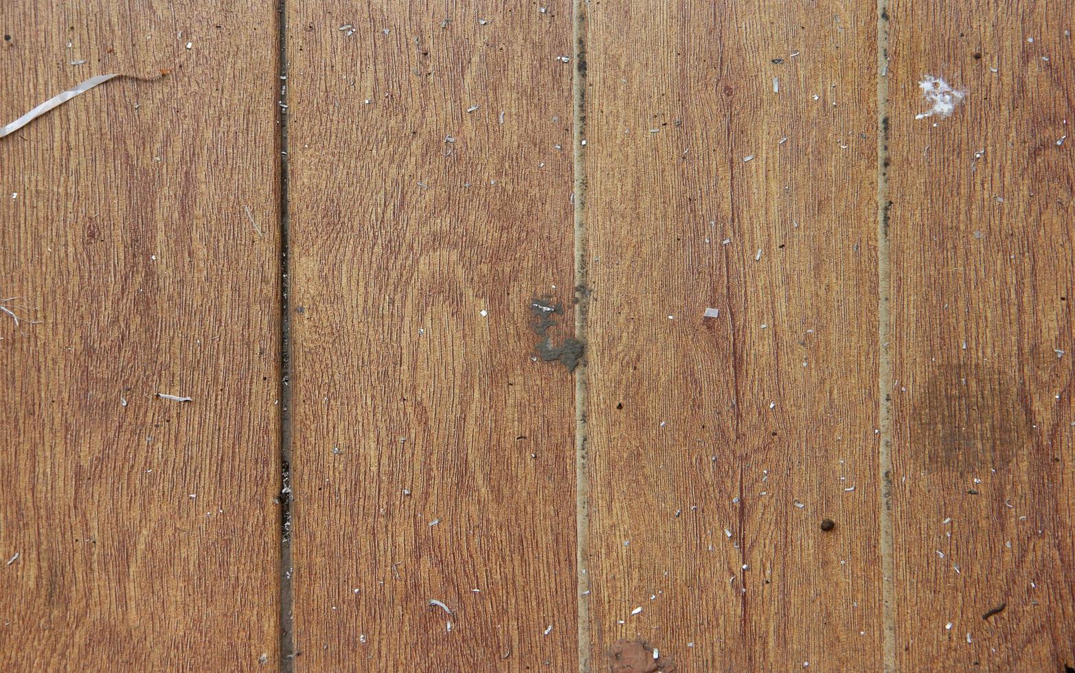 Unclean and dirty wooden floor  or wall textured background with multiple white trash on top of it. photo