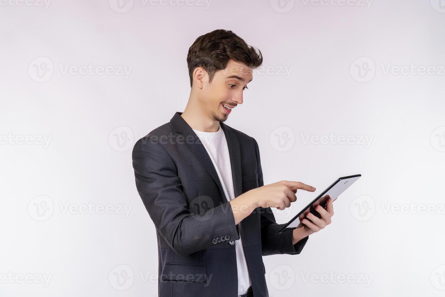 Portrait of attractive cheerful businessman using device app searching web isolated over white color background photo