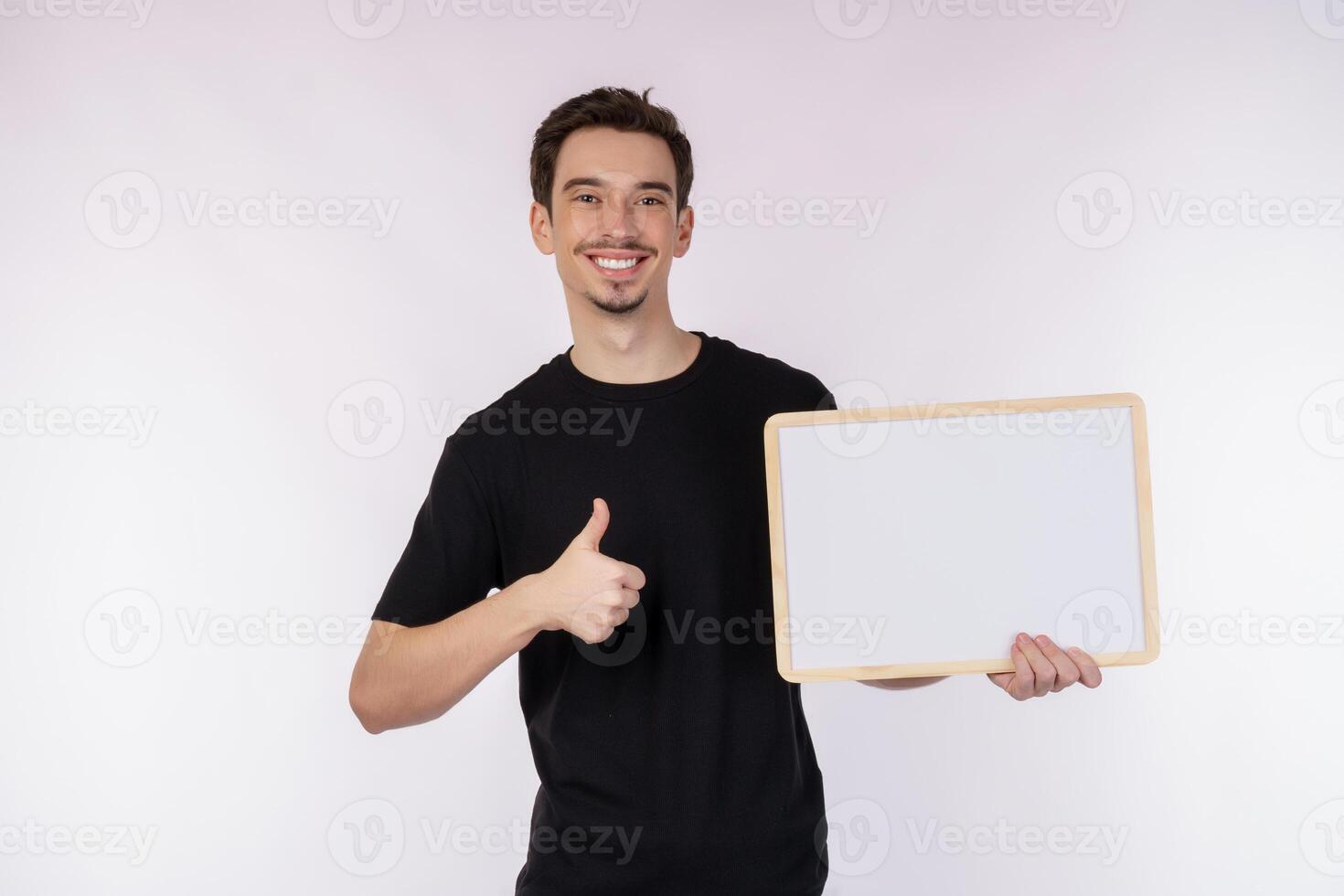 Portrait of happy man showing blank signboard on isolated white background photo