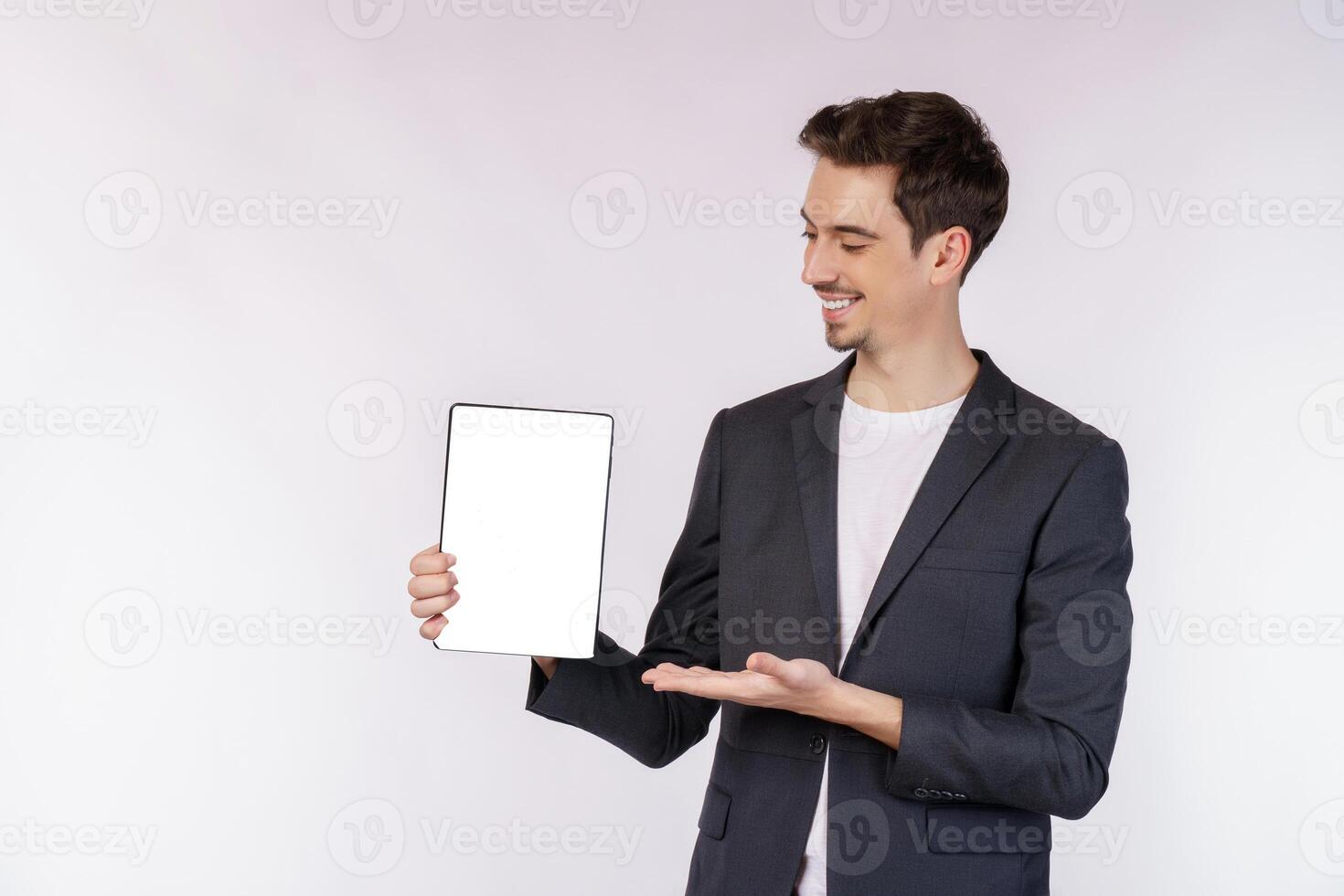 Portrait of attractive cheerful businessman using device app searching web isolated over white color background photo