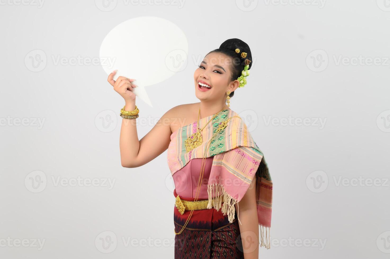 Young beautiful woman in Thai lanna costume with blank speech bubble sign photo