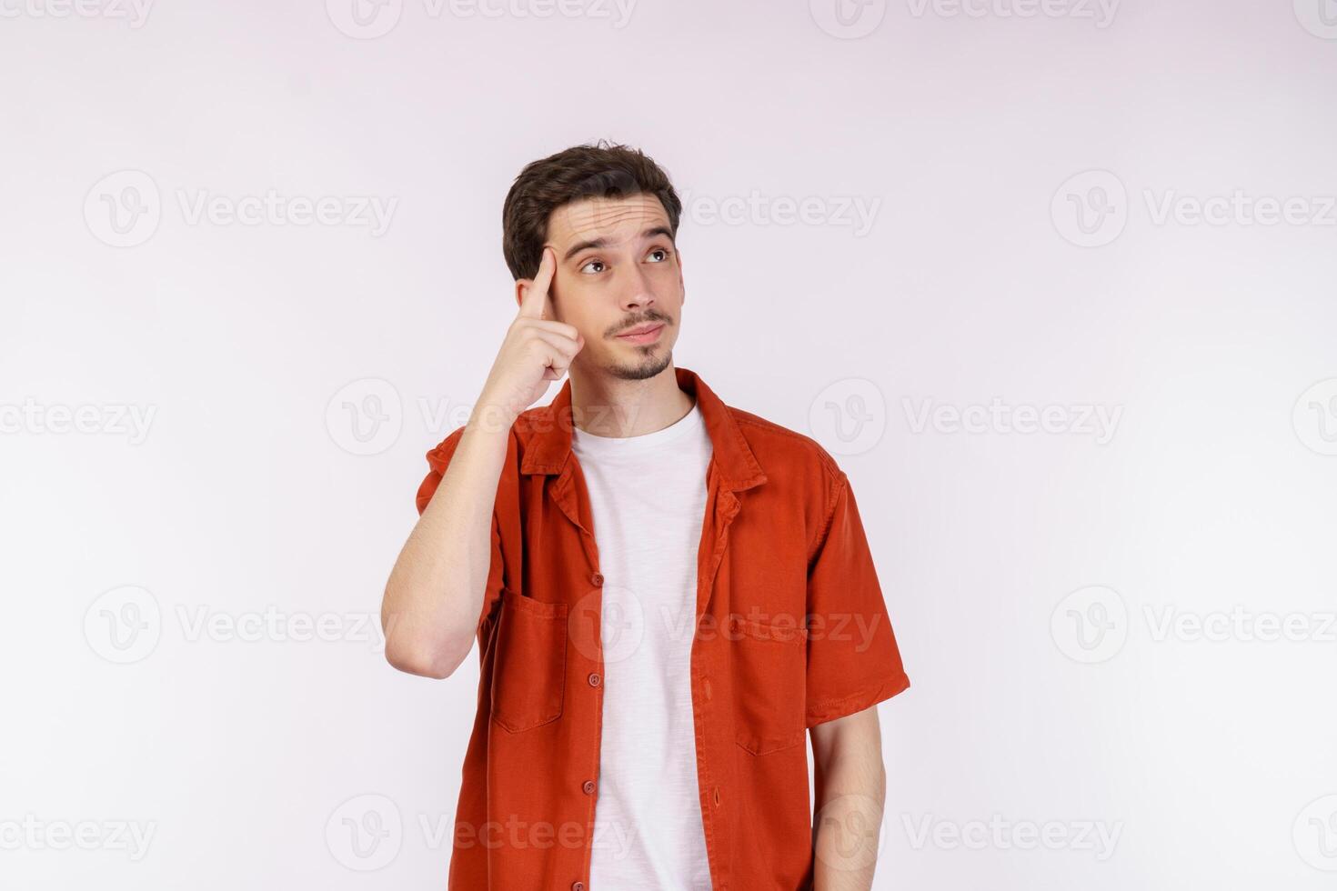 Portrait of thinking man surrounded by question mark on isolated background photo