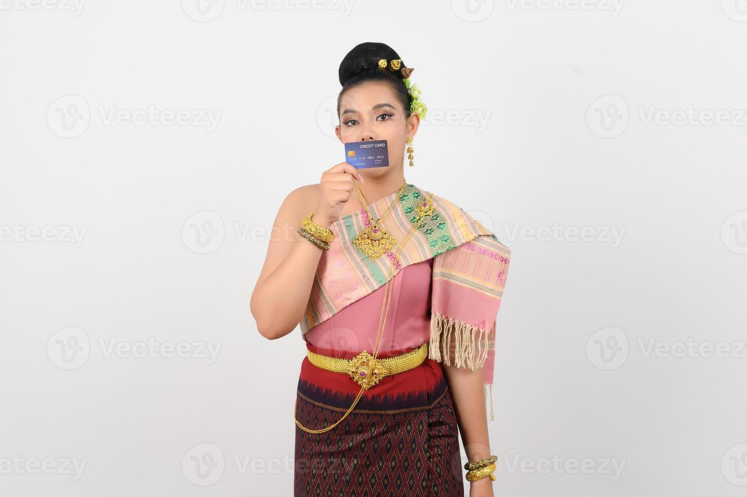 Young beautiful woman in northeastern dress show credit card posture photo
