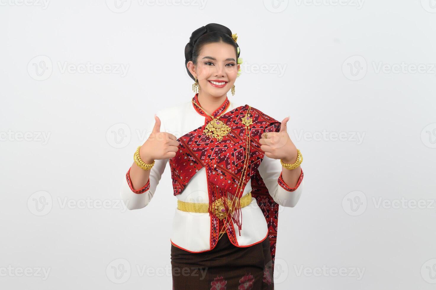 Young beautiful woman in northeastern dress stand and thumb up posture photo