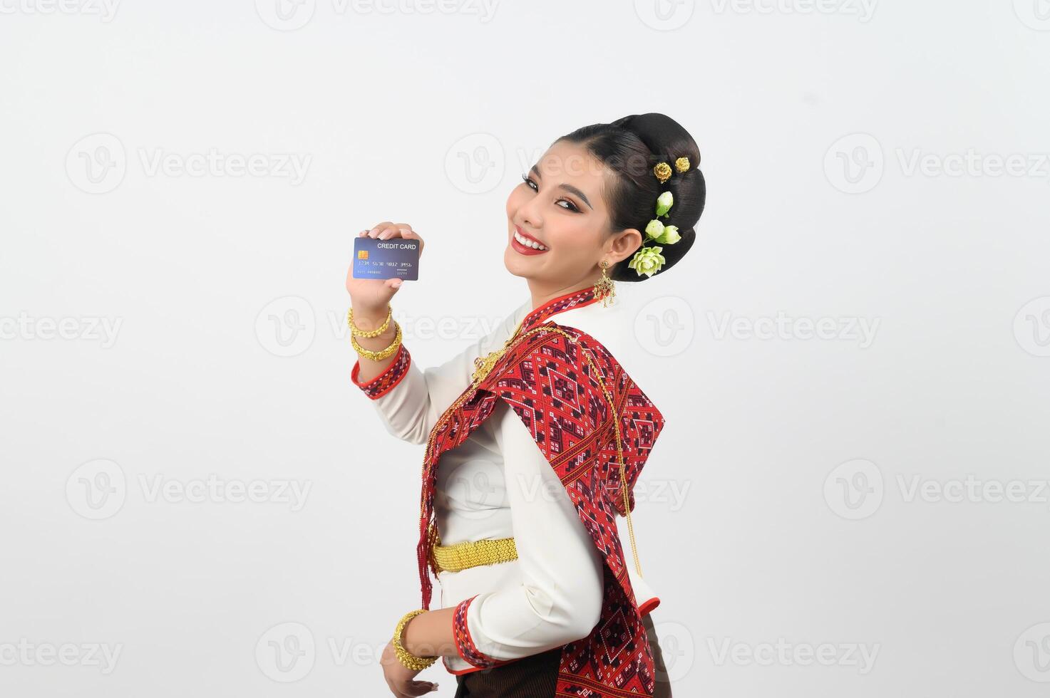 Portrait of Beautiful Thai Woman in Traditional Clothing Posing with credit card photo