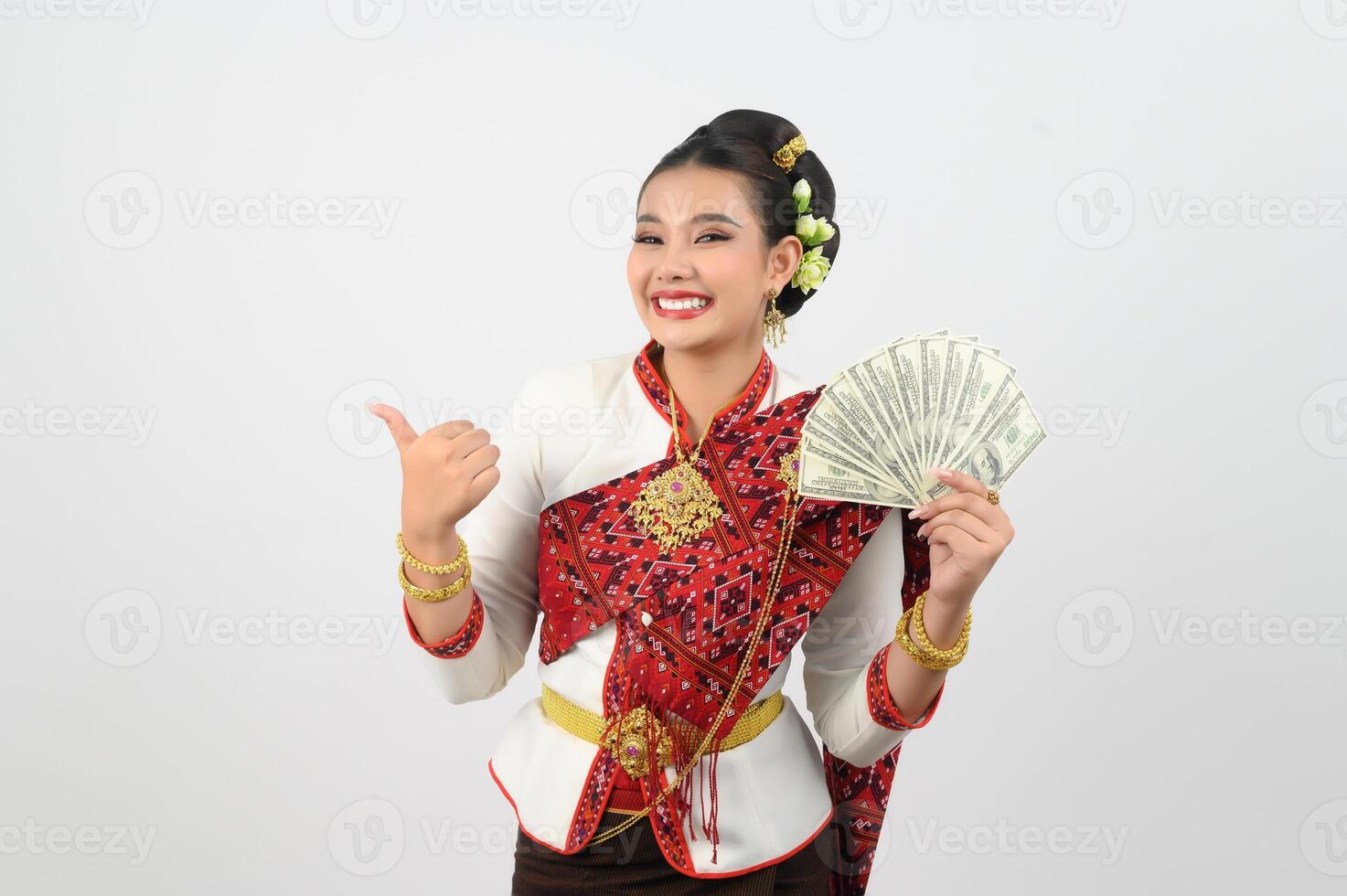 Portrait of Beautiful Thai Woman in Traditional Clothing Posing with fan Banknote photo