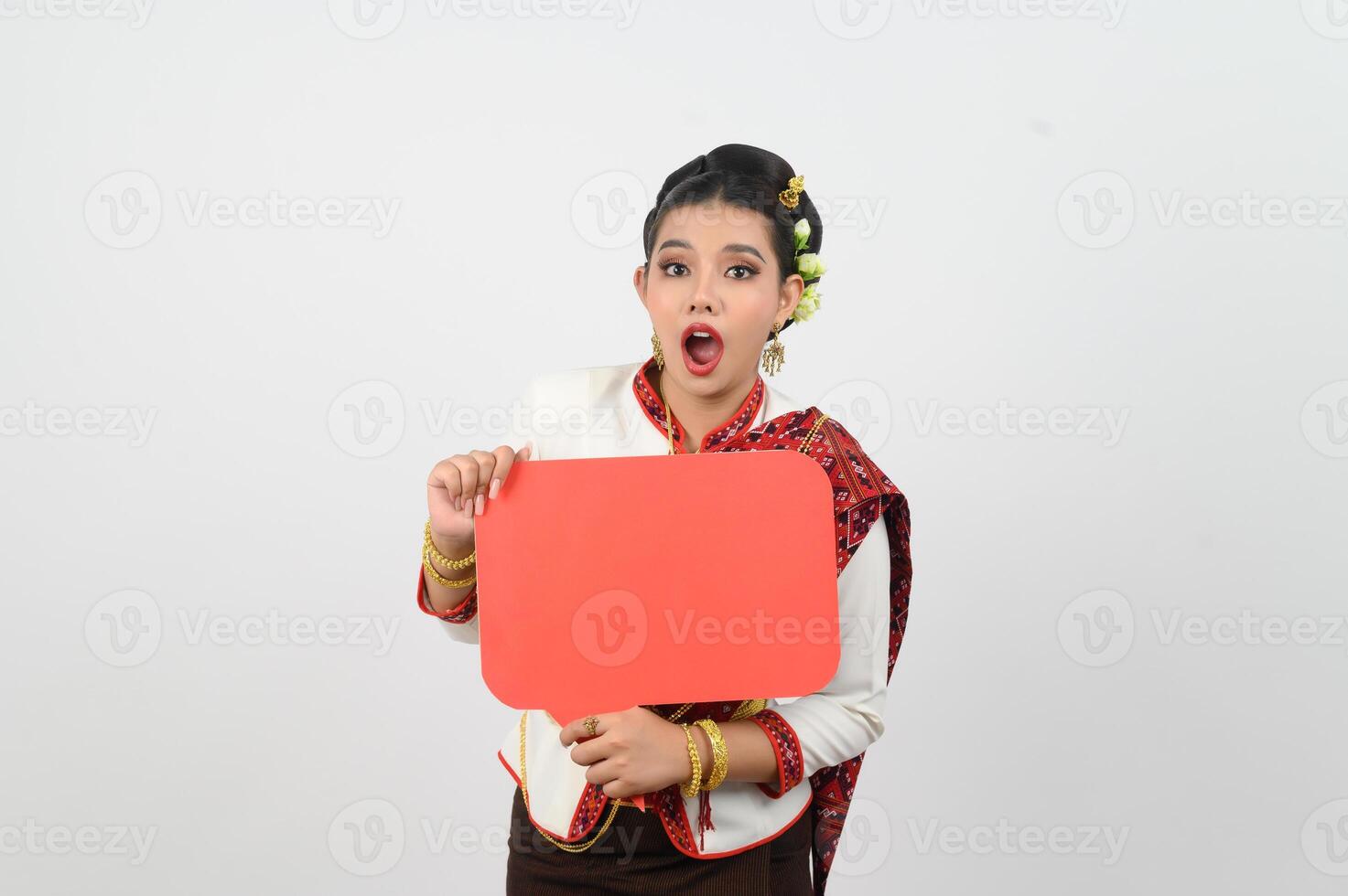 Young beautiful woman in Thai lanna costume with blank speech bubble sign photo