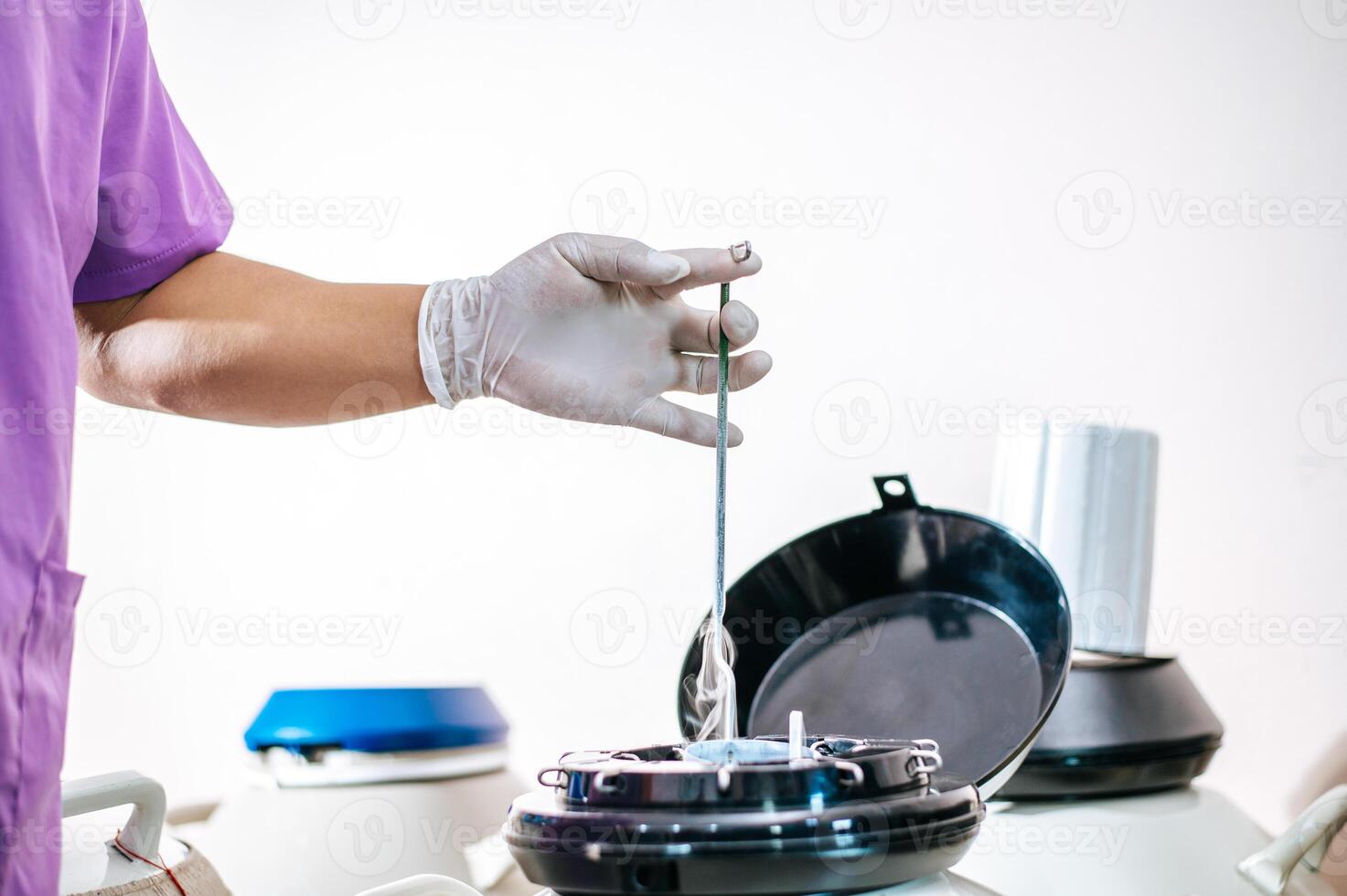 Close up hand of researcher testing in a laboratory. Modern technologies in agriculture management, agribusiness and research concept. photo