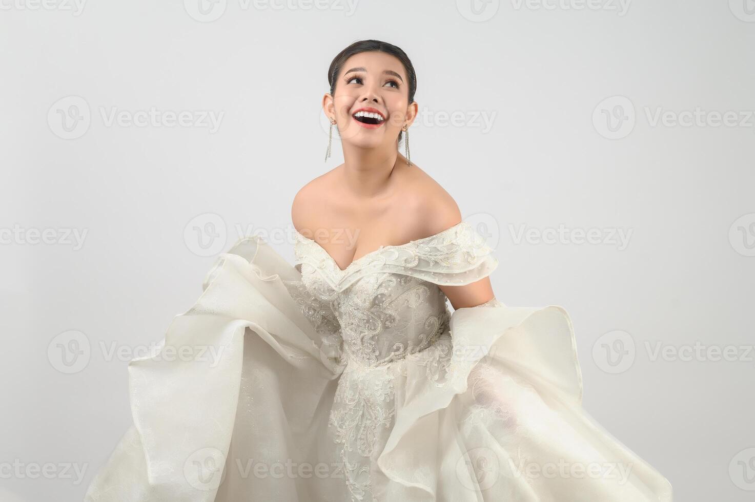 Young asian beautiful bride smiling with happy on white background photo