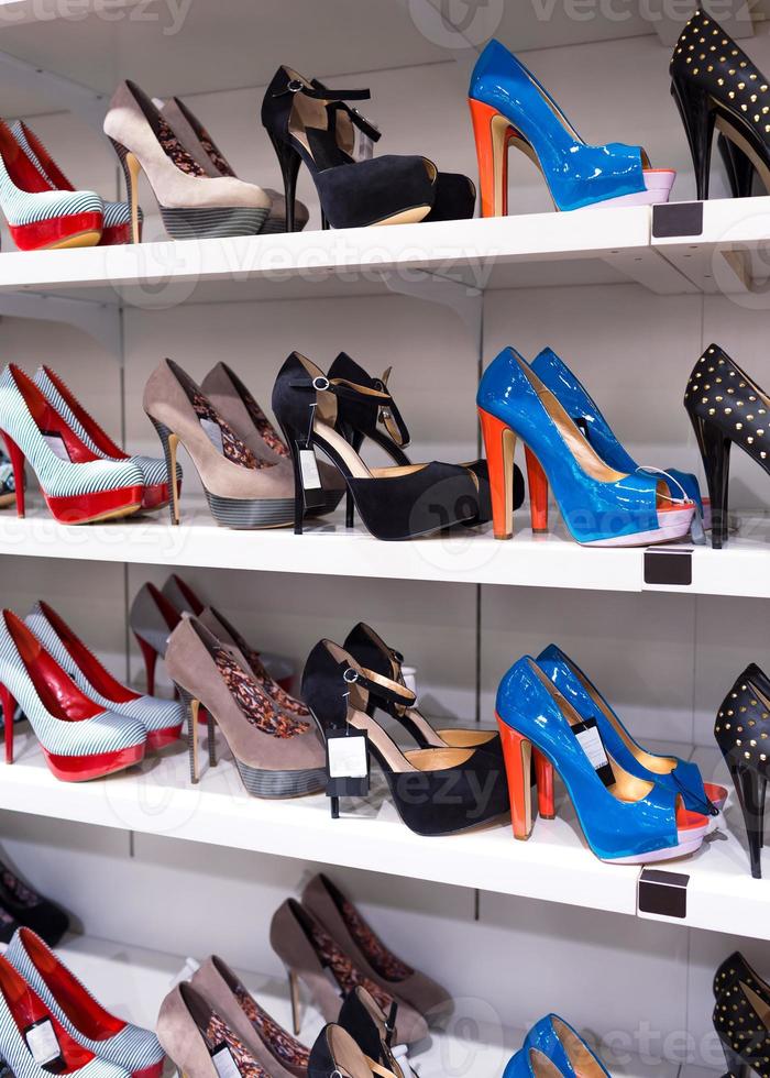 Background with shoes on shelves photo