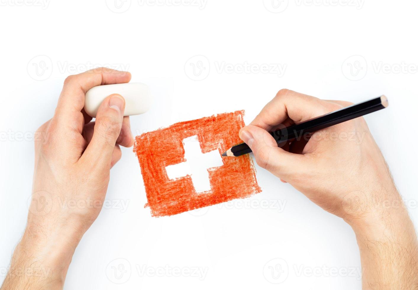 Man's hands with pencil draws flag of Switzerland on white photo