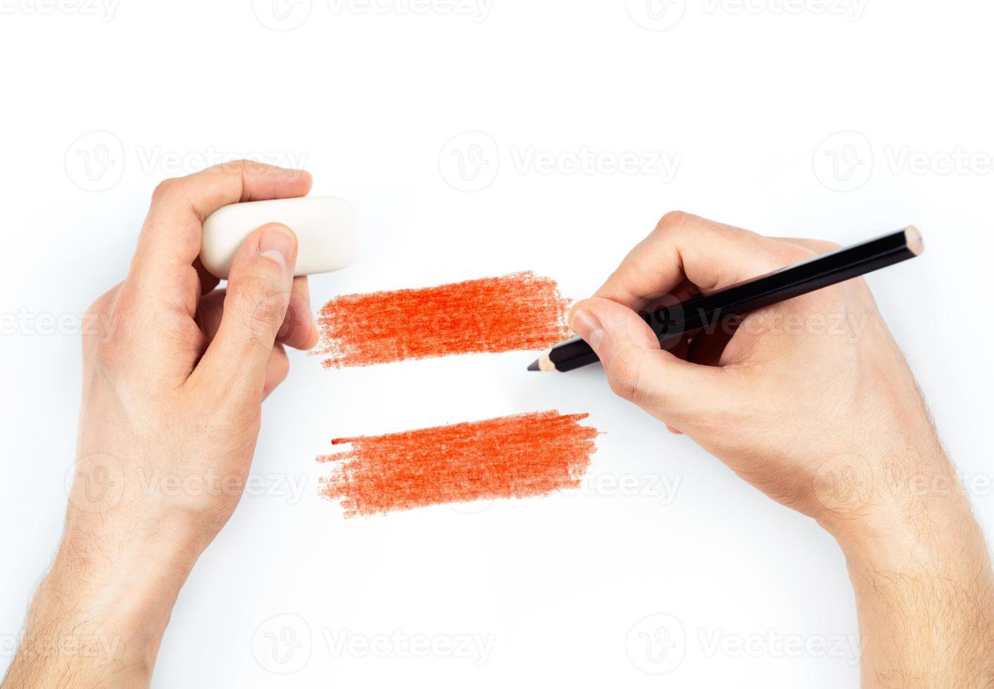 Man's hands with pencil draws flag of Austria on white photo