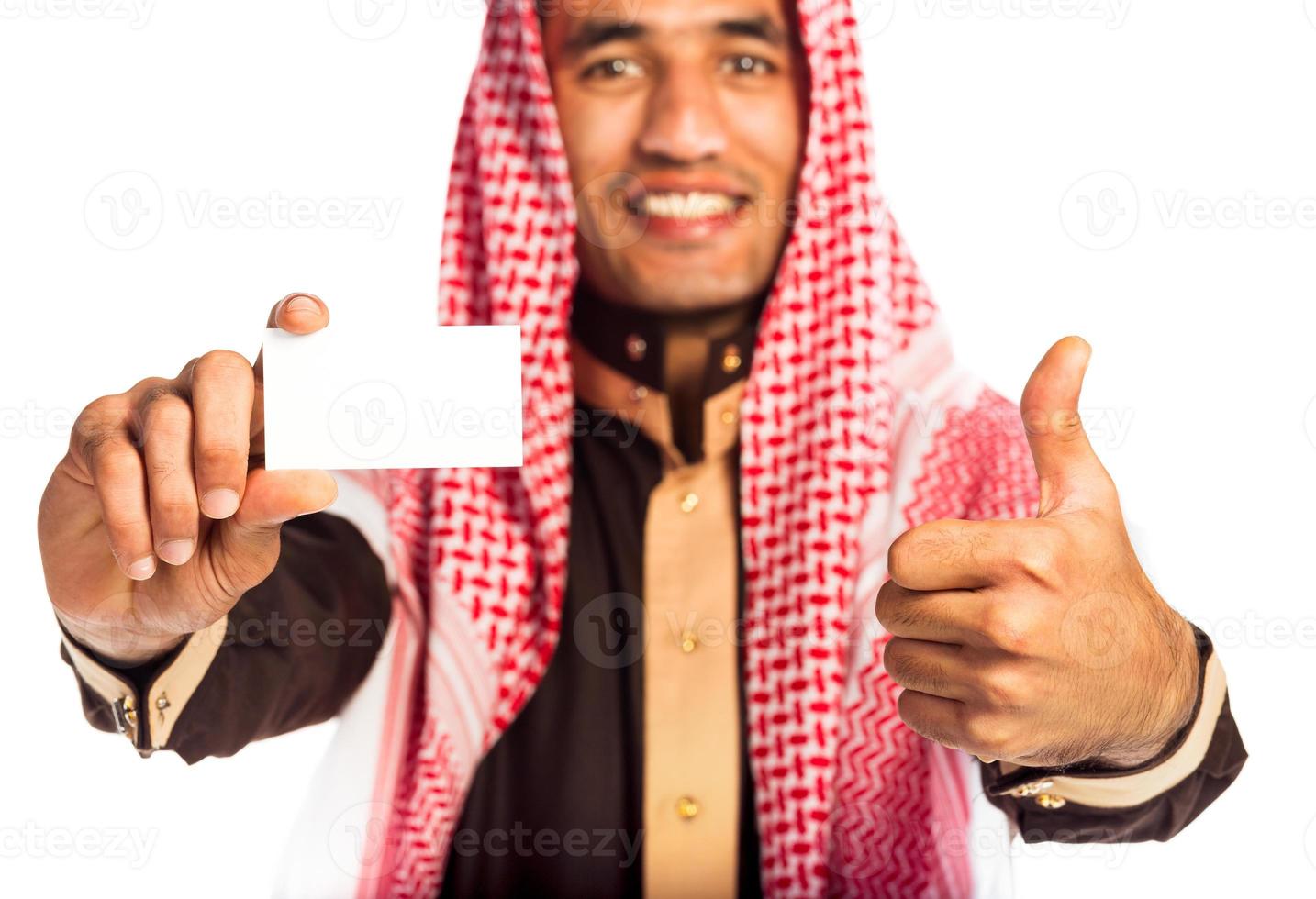 Young smiling arab showing business card in hand isolated on white photo