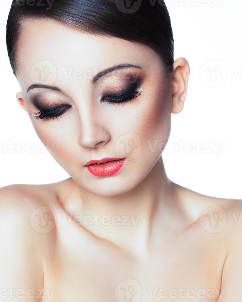 Portrait of a beautiful woman with a glamorous retro makeup photo