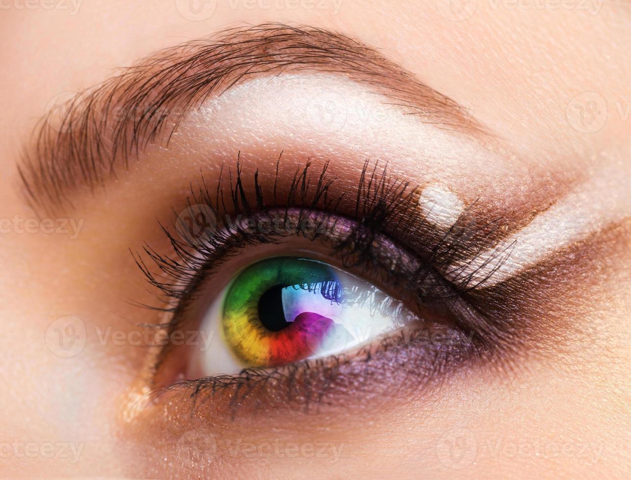 Close up Colourful human eye with makeup photo