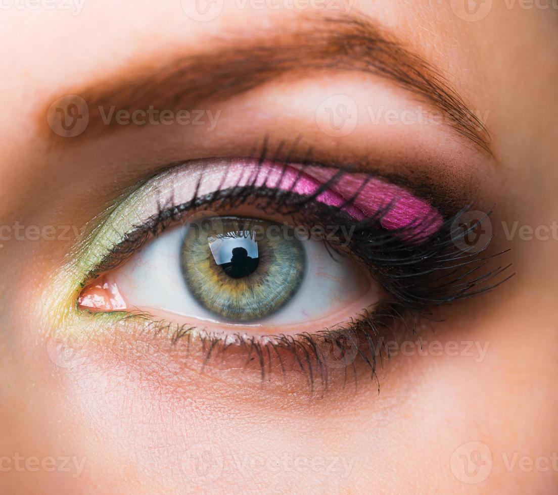 Closeup of womanish eye with glamorous makeup photo