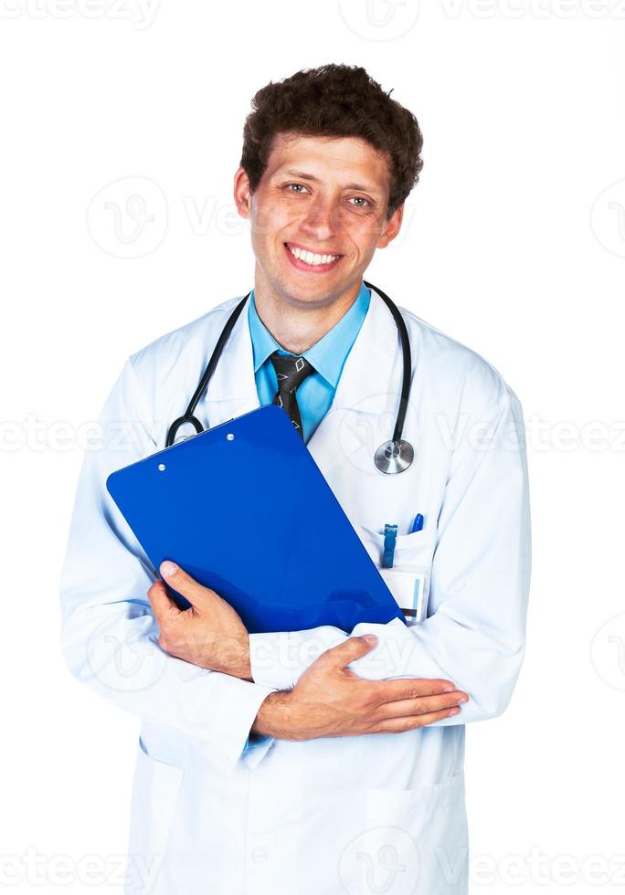 Portrait of a smiling male doctor holding a notepad on white photo