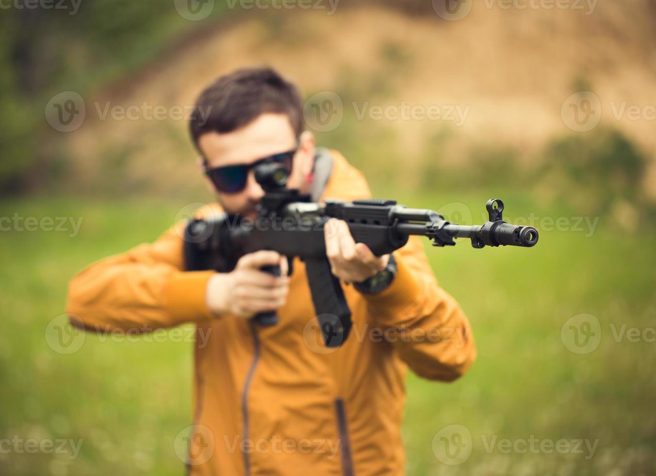 A man with an automatic rifle photo