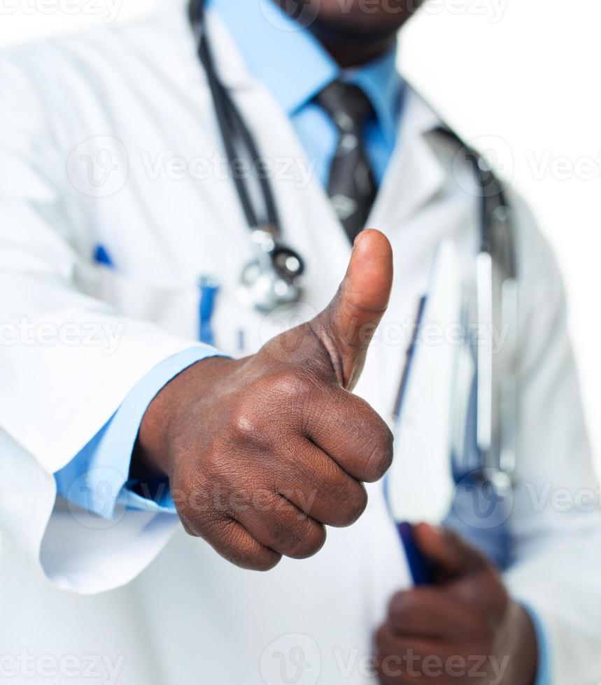 Doctor with thumb up on white photo