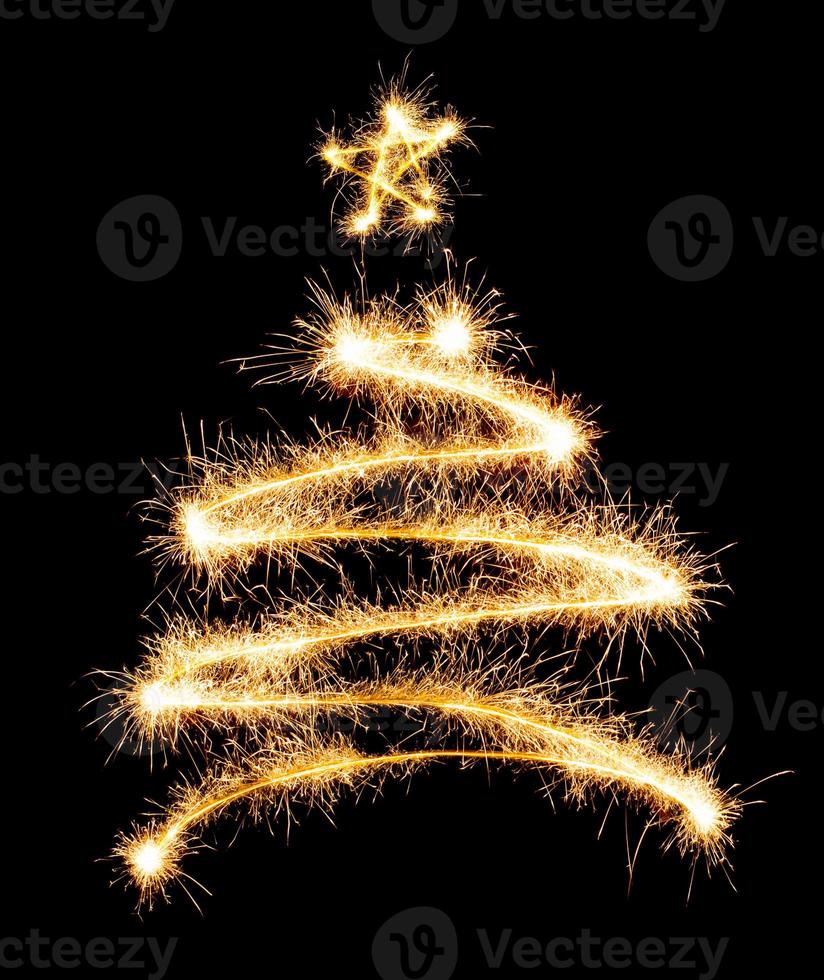 Christmas tree made by sparkler on a black photo