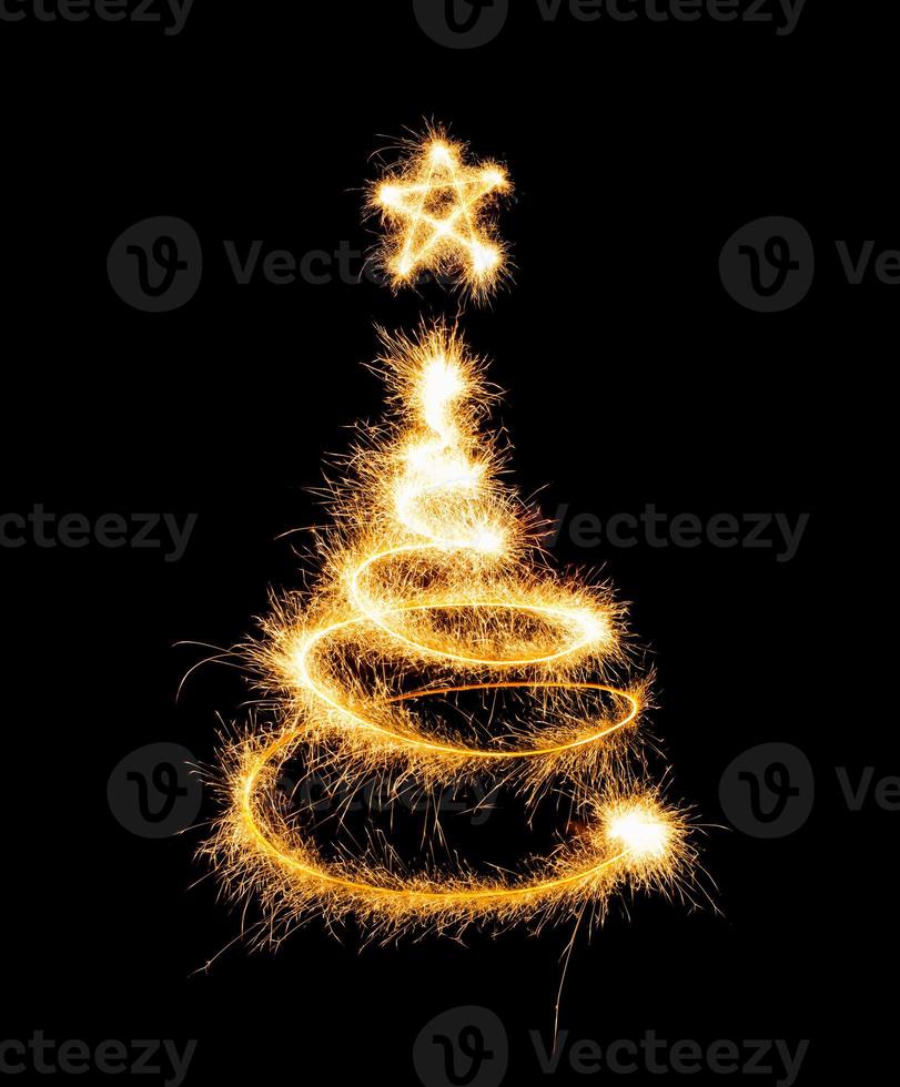 Christmas tree made by sparkler on a black photo