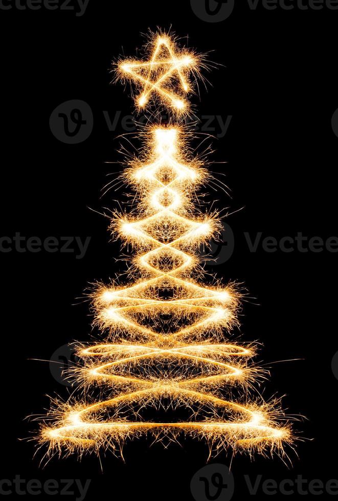 Christmas tree made by sparkler on a black photo