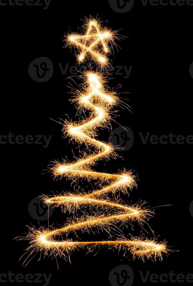 Christmas tree made by sparkler on a black photo