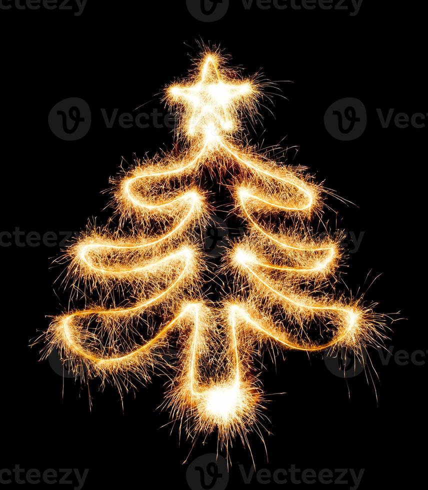 Christmas tree made by sparkler on a black photo