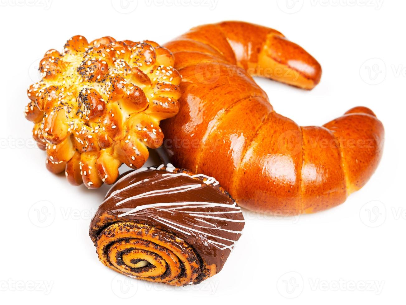 Fresh and tasty buns with with sesame and poppy seeds, bagel with jam and roll with chocolate photo