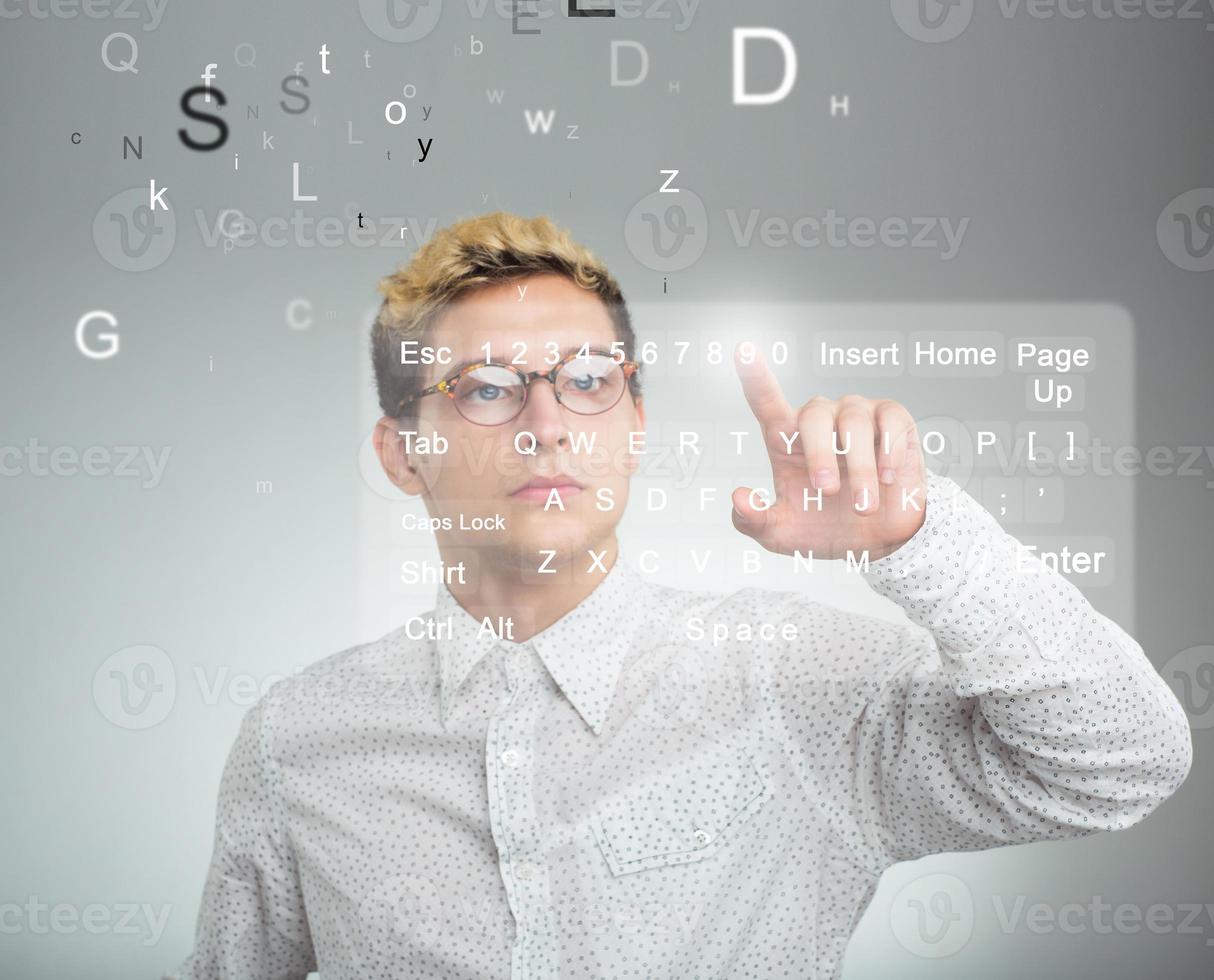 Businessman pressing application button on computer with touch screen photo