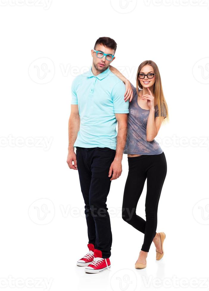 Beautiful young happy couple smiling, man and woman looking at camera, isolated over white photo