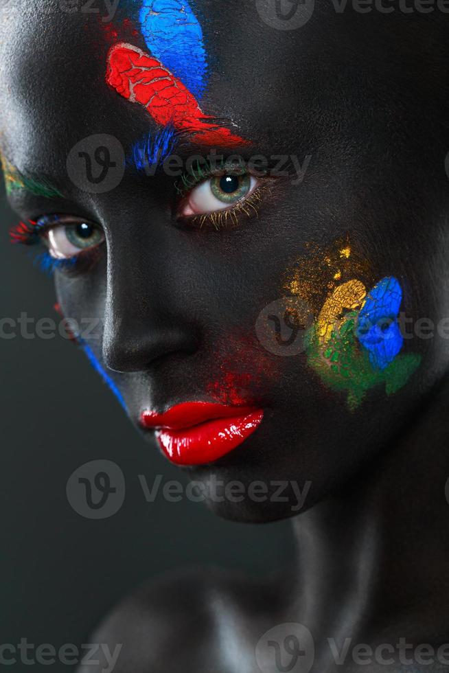 Portrait of a beautiful woman with black face photo