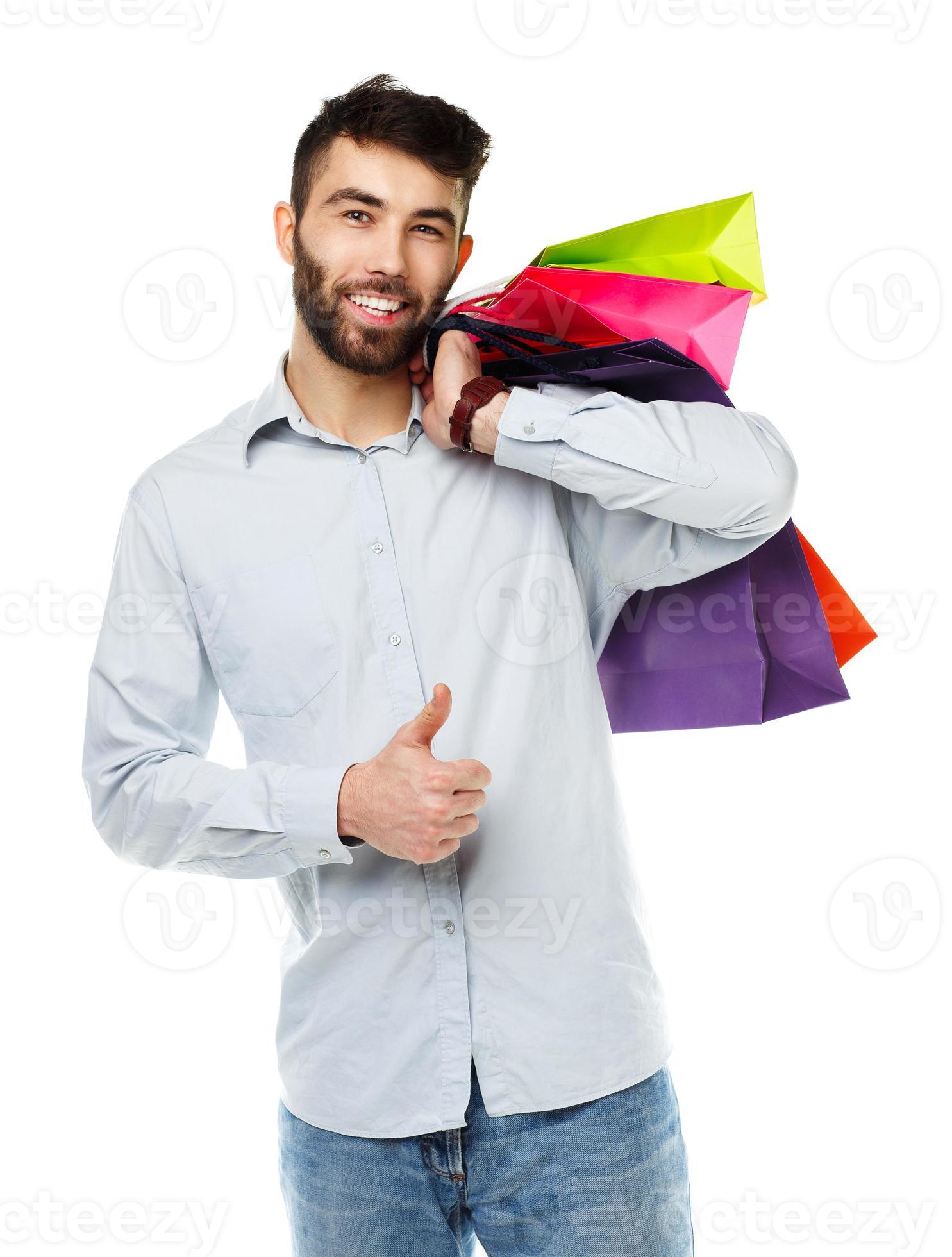 Handsome man holding shopping bags 21047083 Stock Photo at Vecteezy