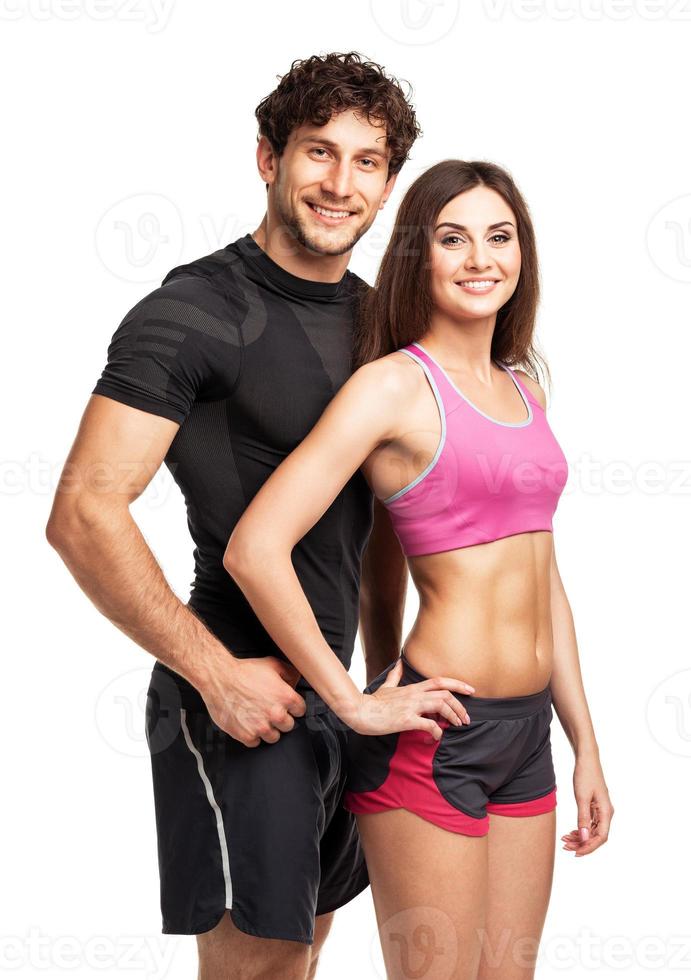 Athletic man and woman after fitness exercise on the white photo