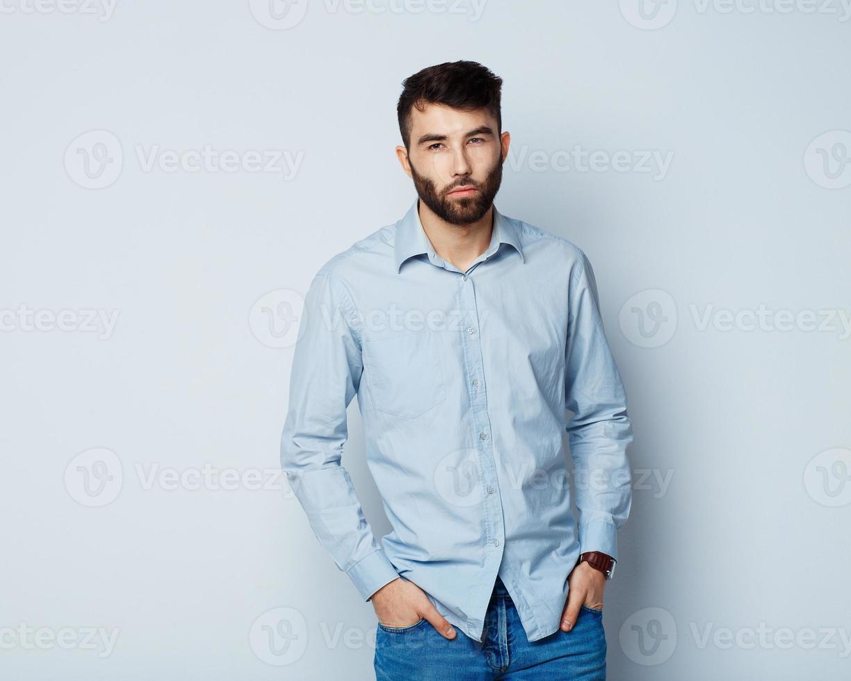 A young man with a serious expression on his face photo