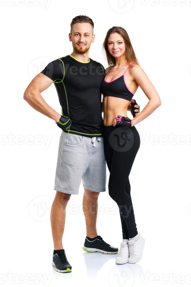 Athletic man and woman after fitness exercise on the white photo