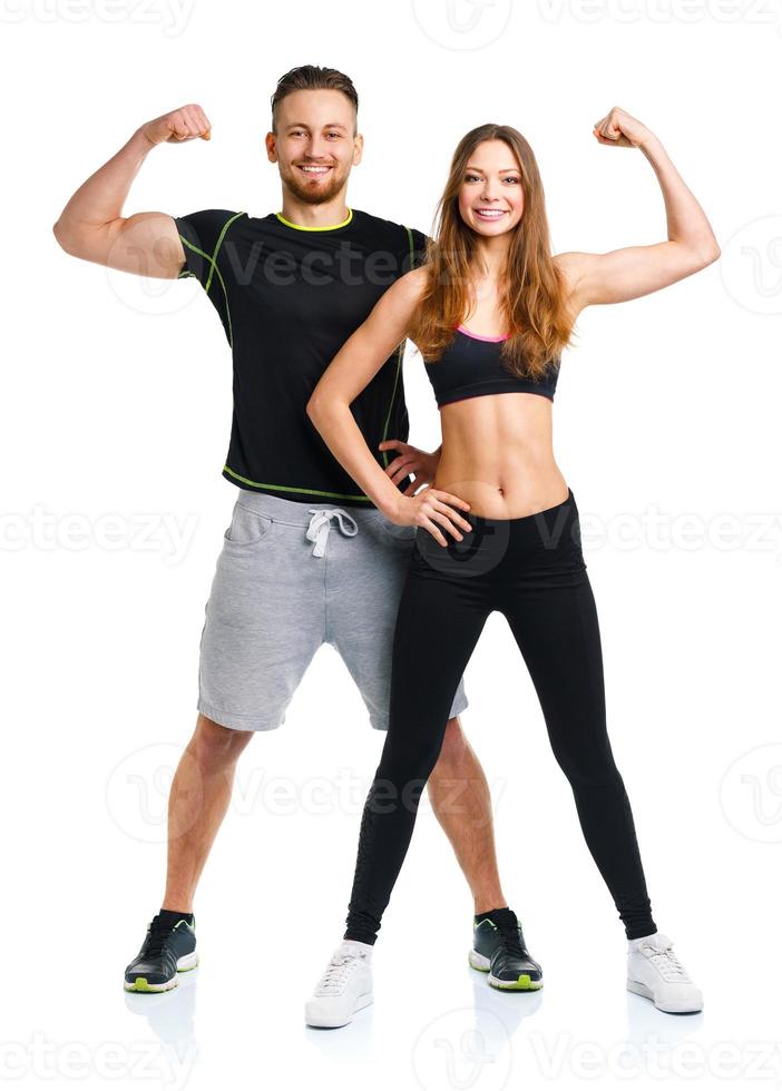 Athletic man and woman after fitness exercise on the white photo