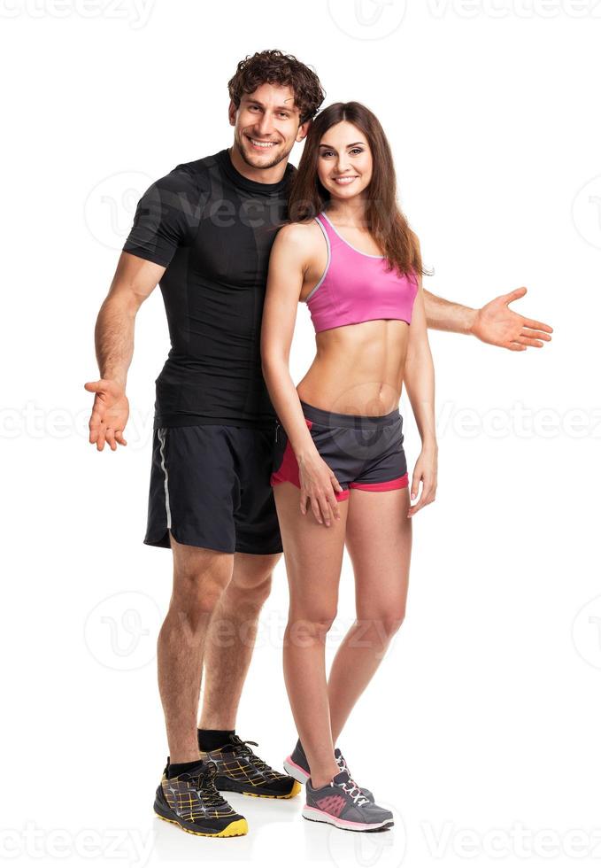 Athletic couple after fitness exercise on the white photo