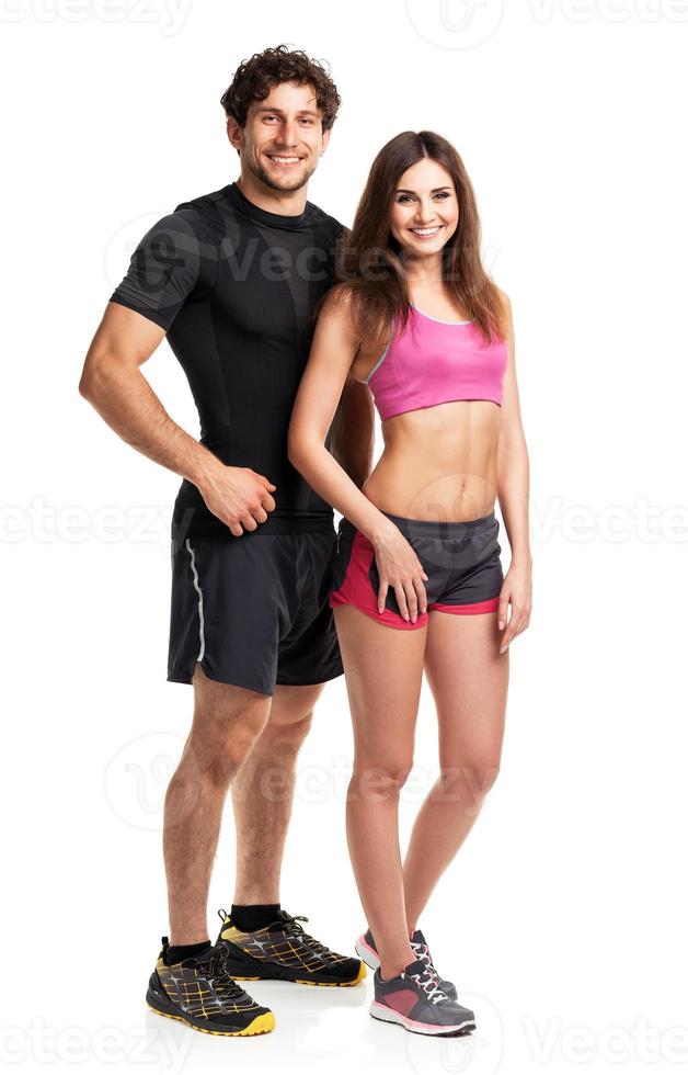 Athletic couple after fitness exercise on the white photo