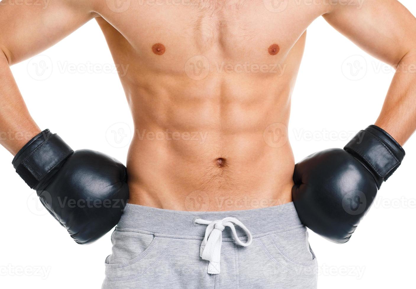 Sport man wearing boxing gloves on the white photo