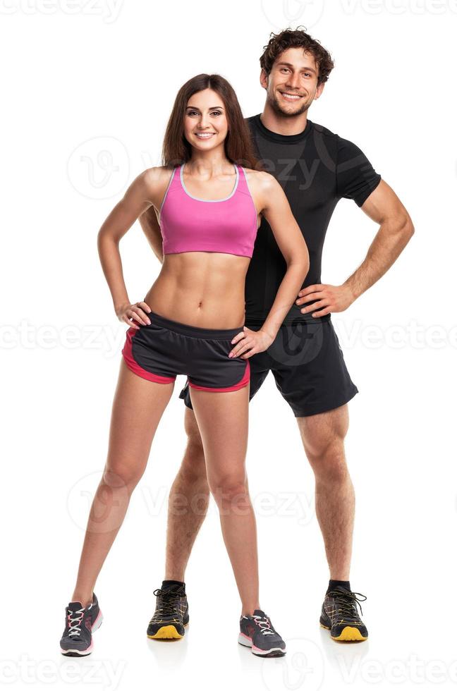 Sport couple - man and woman after fitness exercise on the white photo