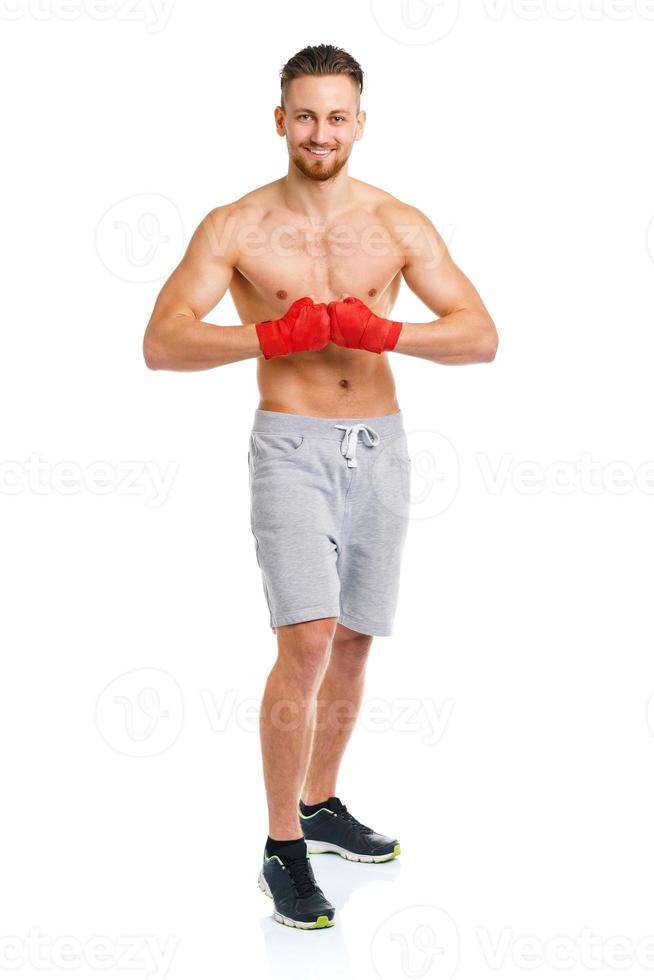 Athletic attractive man wearing boxing bandages on the white photo