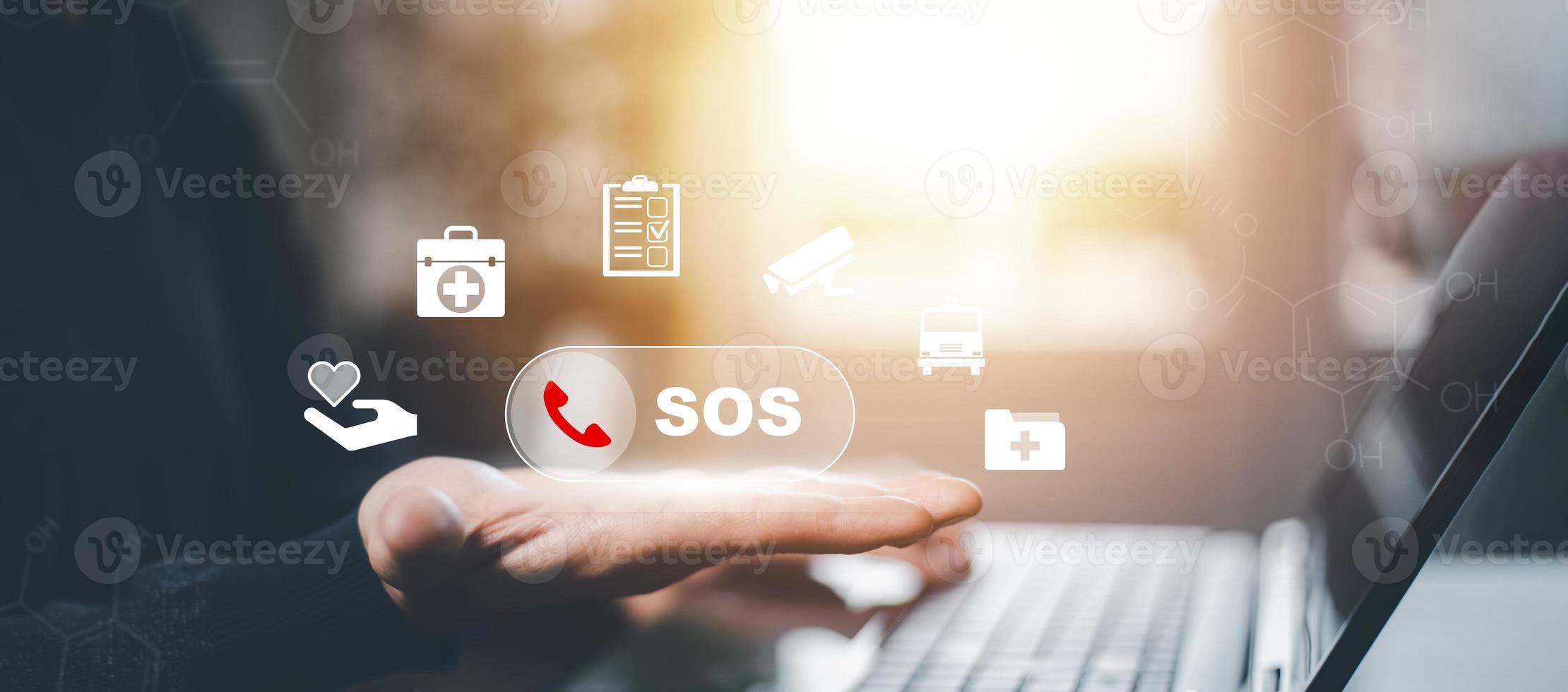 Man hand hold SOS Emergency app in home, call phone, Chat message icon, Emergency application from smartphone for elderly, technology concept.Old hand touch mobile phone and call for help. photo