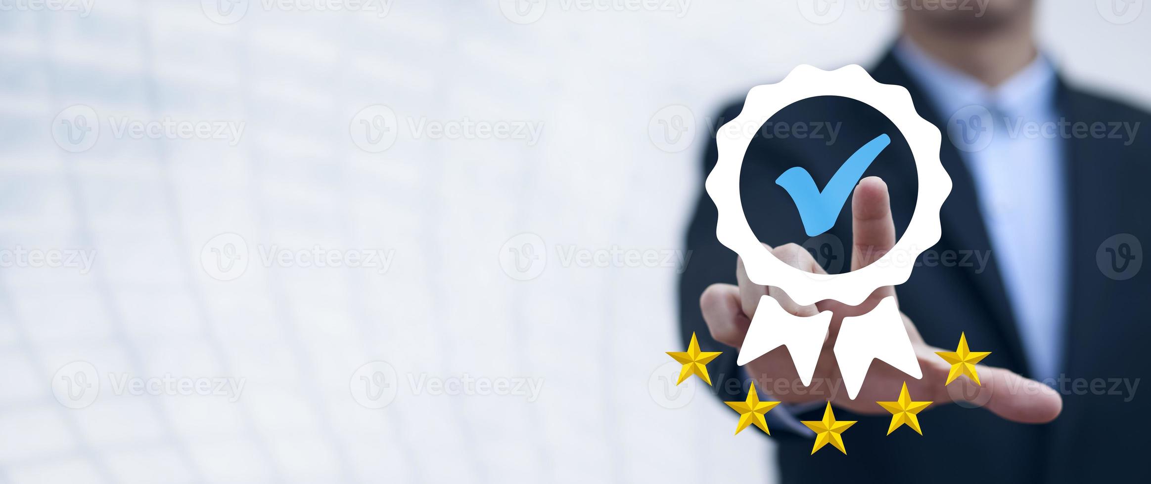 Quality assurance of business services, Businessman Hand shows the sign of the top service Quality assurance in Black background , Guarantee, Standards, ISO certification and standardization concept. photo