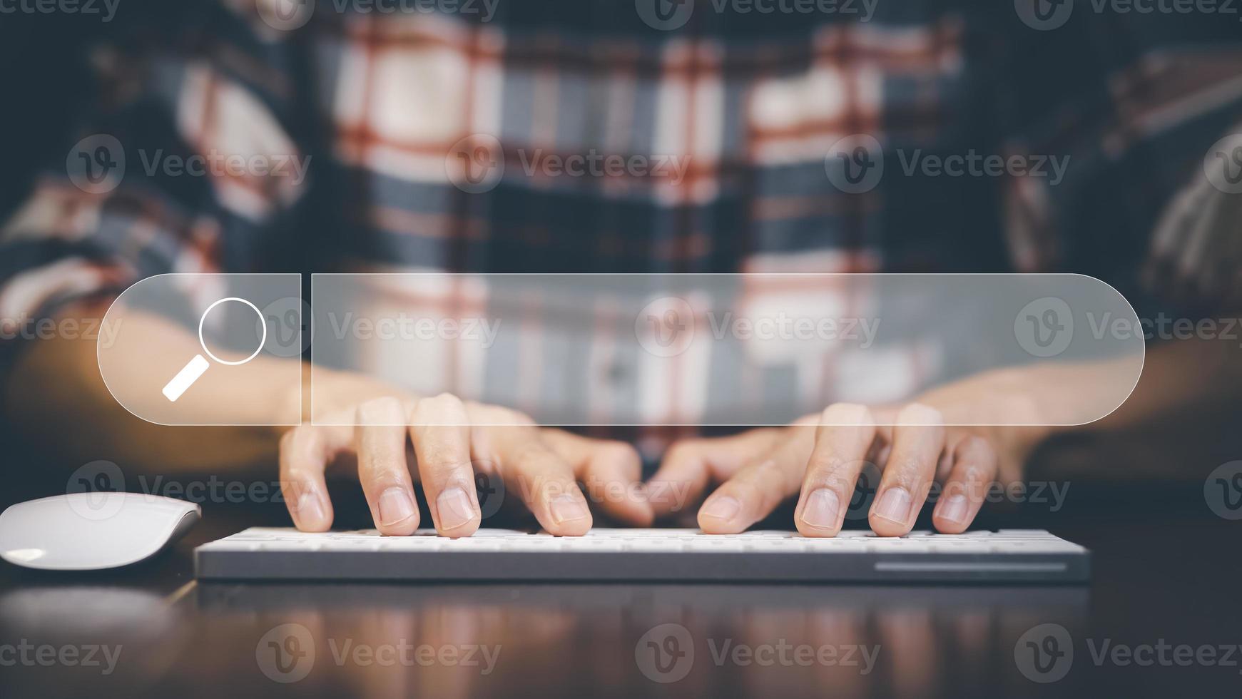 Searching Browsing Internet Data Information with blank search bar. man's hands are using a computer keyboard to Searching for information. Using Search Console with your website. photo
