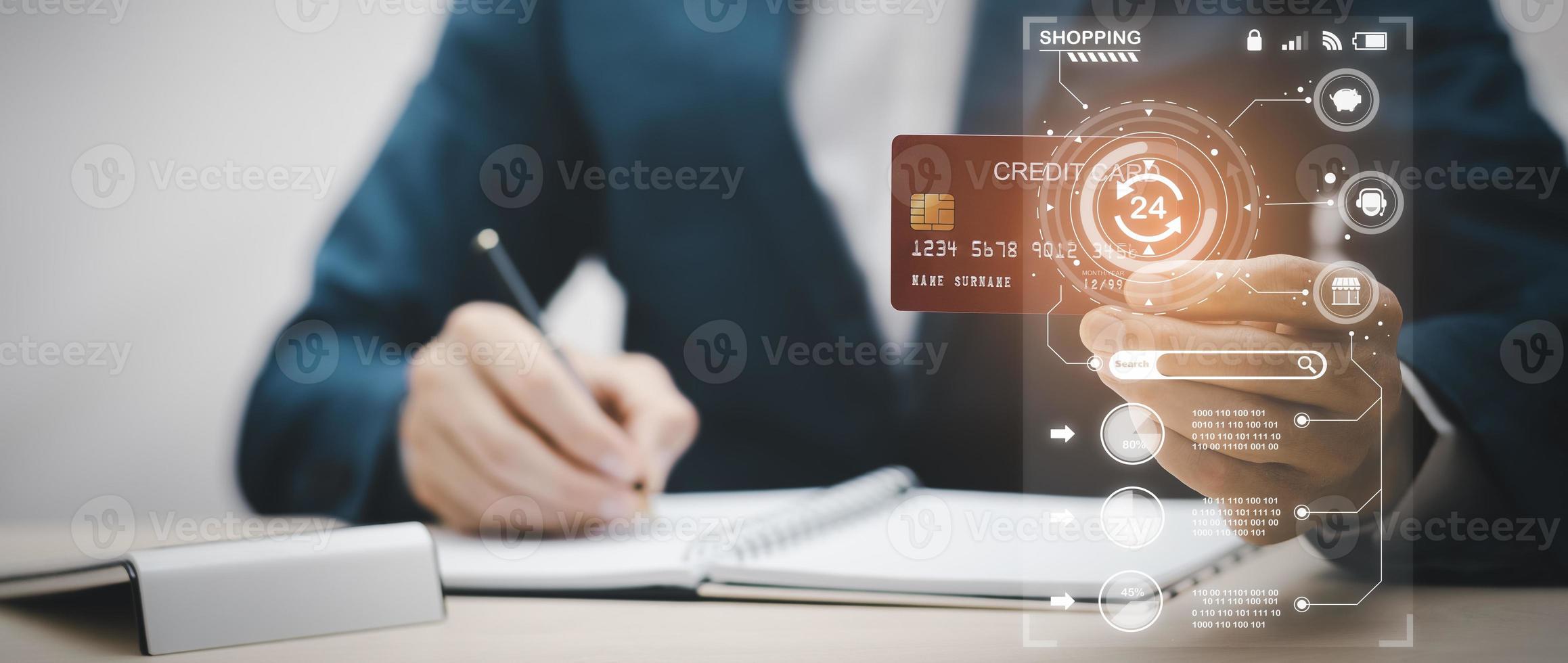 Man holding credit card for makes a purchase on the Internet on the laptop computer with credit card, online payment, shopping online, e-commerce, internet banking, spending money concept. photo