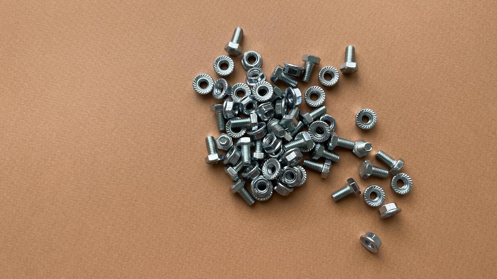 Bolts and nuts top view. Fasteners. photo