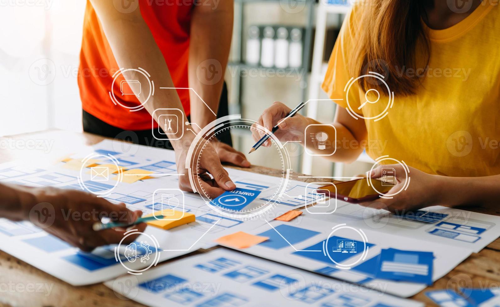 UX developer and ui designer brainstorming about mobile app interface wireframe design with customer breif and color code at modern office. photo